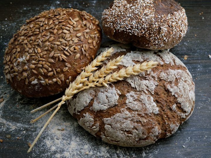 Fresh bread on a linen cloth dusted with flour