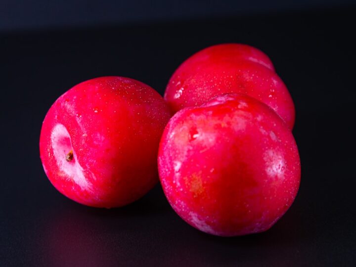 A tall glass of deep-magenta kokum sharbat cooled from a Konkan kitchen